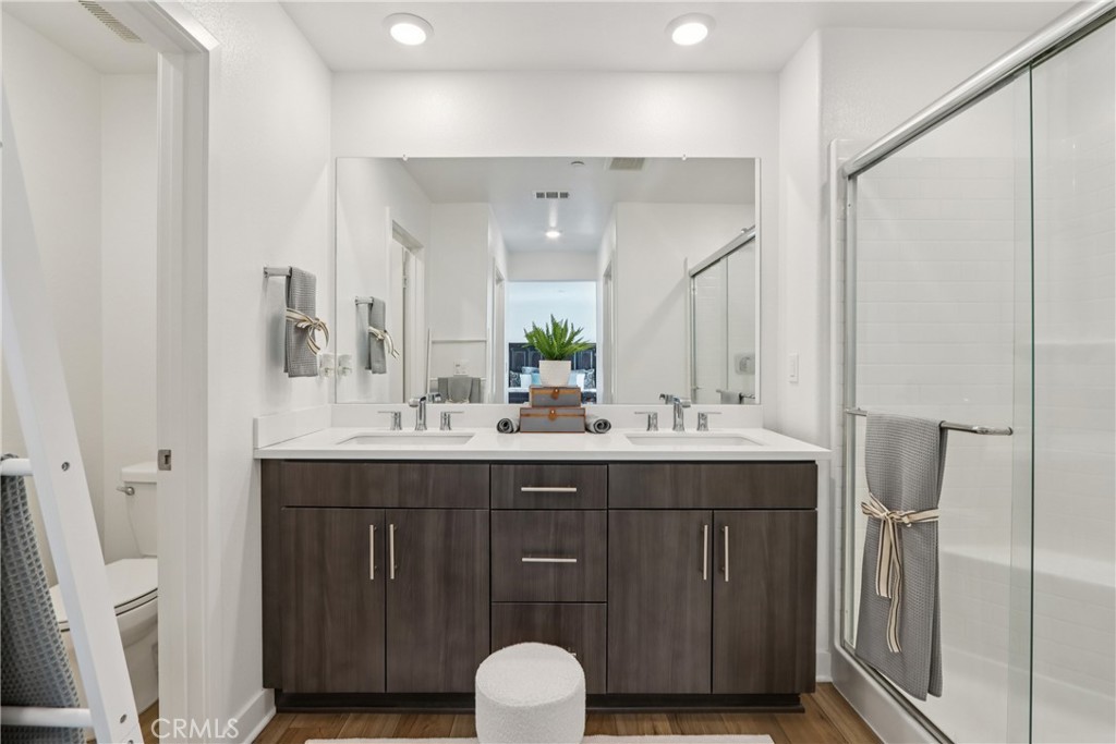 2464 Yellowstone Way Rialto, CA 92377 - Photo 35 of 75 a bathroom with a double vanity sink and a mirror