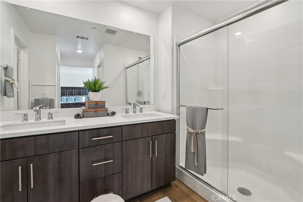 2464 Yellowstone Way Rialto, CA 92377 - Photo 36 of 75 a bathroom with a double vanity sink mirror and double