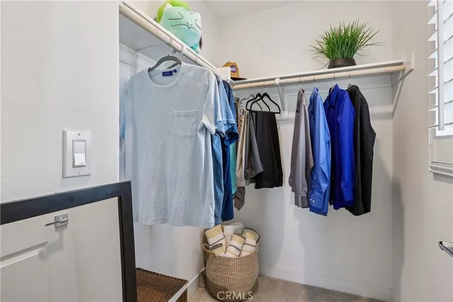 an aerial view of a house with a garden and lake view