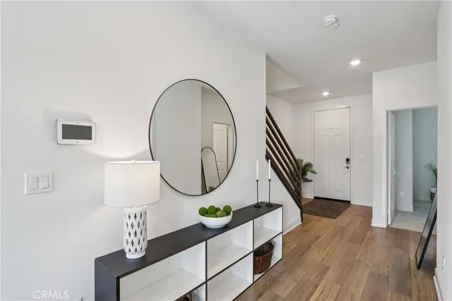 a kitchen with stainless steel appliances a sink a stove a refrigerator cabinets and a center island