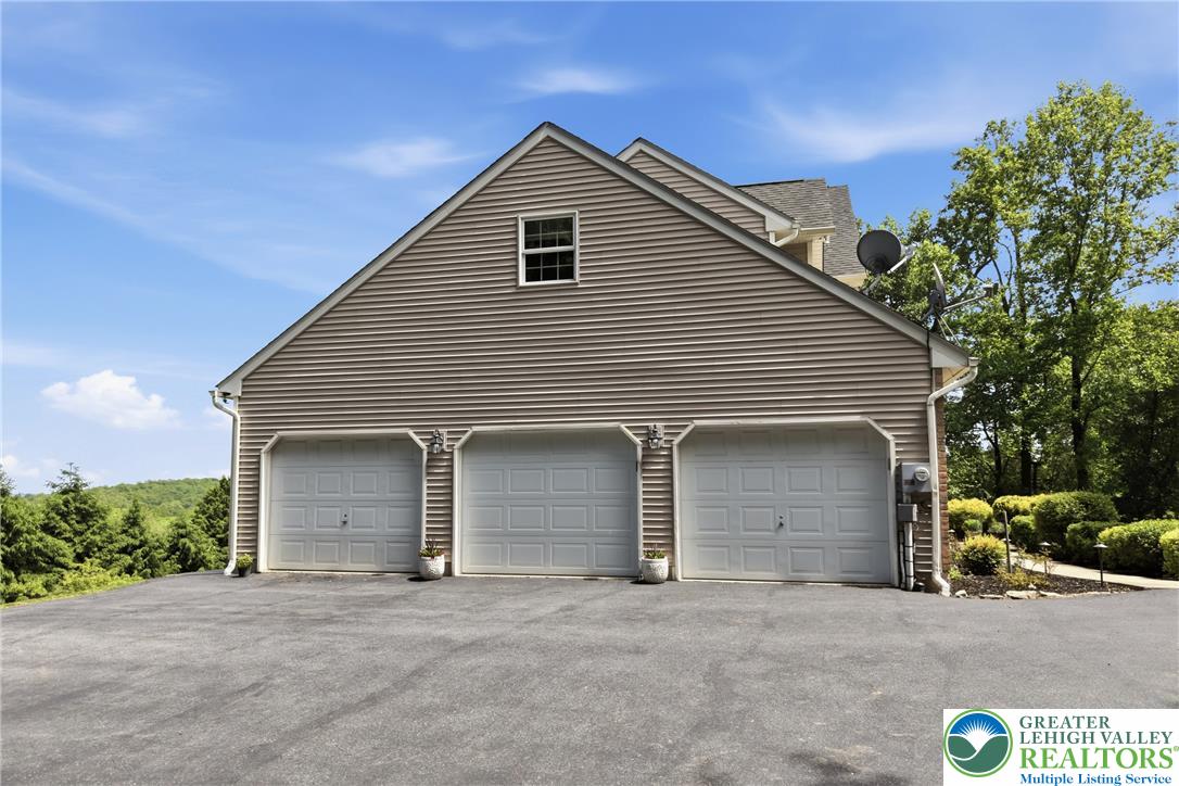 115 West Butternut Road Hellertown, PA 18055 - Photo 91 of 97 A spacious three-car garage provides ample parking and storage for any homeowner.