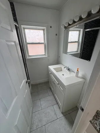 a bathroom with a sink toilet and tub