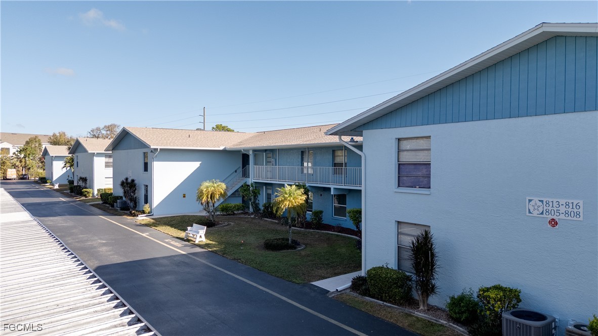 1100 Pondella Road, Unit 801 Cape Coral, FL 33909 - Photo 21 of 24 a front view of a house with outdoor seating