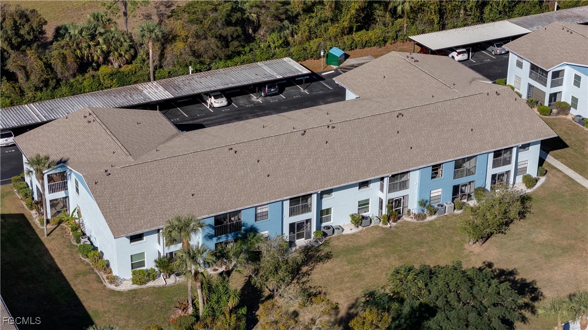 1100 Pondella Road, Unit 801 Cape Coral, FL 33909 - Photo 22 of 24 an aerial view of a house with a yard