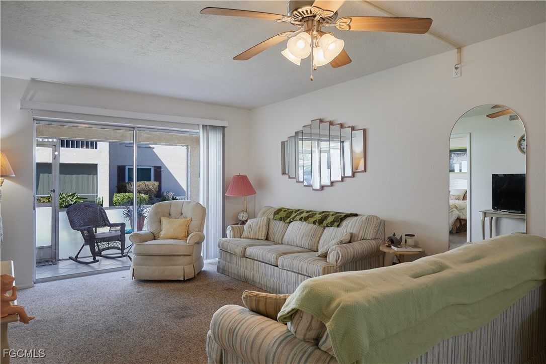 1100 Pondella Road, Unit 801 Cape Coral, FL 33909 - Photo 10 of 24 a living room with furniture and a large window