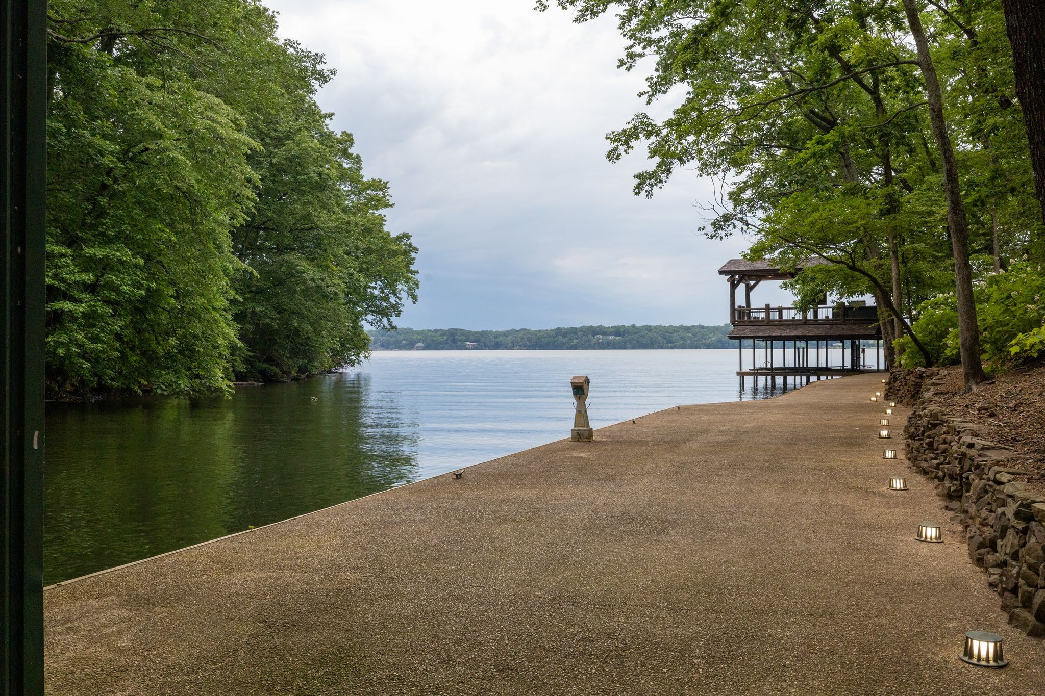 721 Three Point Road Muscle Shoals, AL 35661 - Photo 12 of 51 a view of a lake with a building in the background