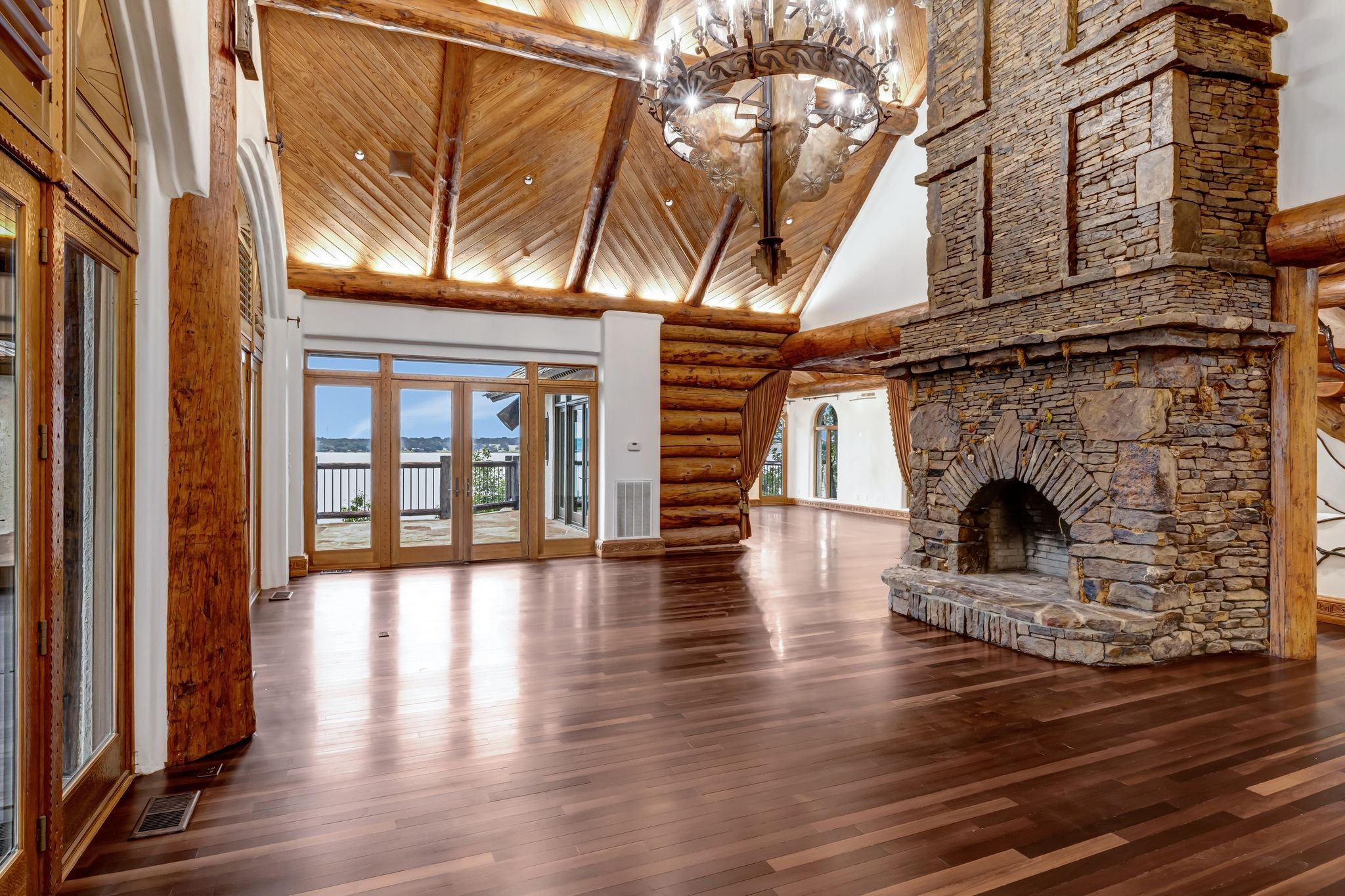 721 Three Point Road Muscle Shoals, AL 35661 - Photo 14 of 51 a view of an empty room with wooden floor and a window