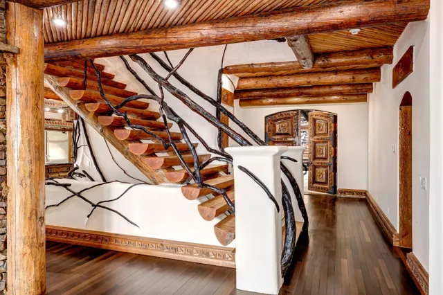 a room with furniture and a floor to ceiling window