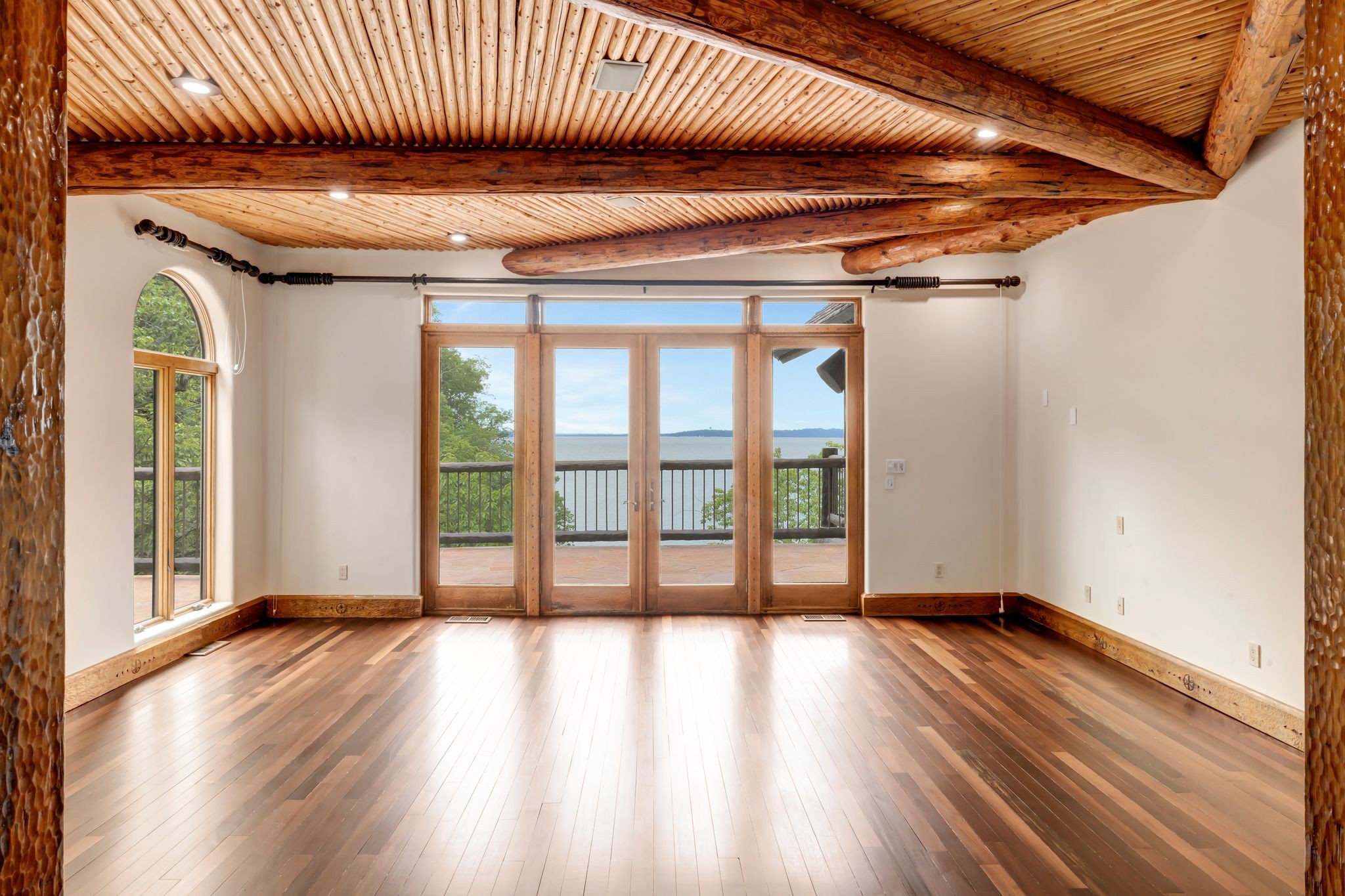 721 Three Point Road Muscle Shoals, AL 35661 - Photo 20 of 51 a view of an empty room with wooden floor