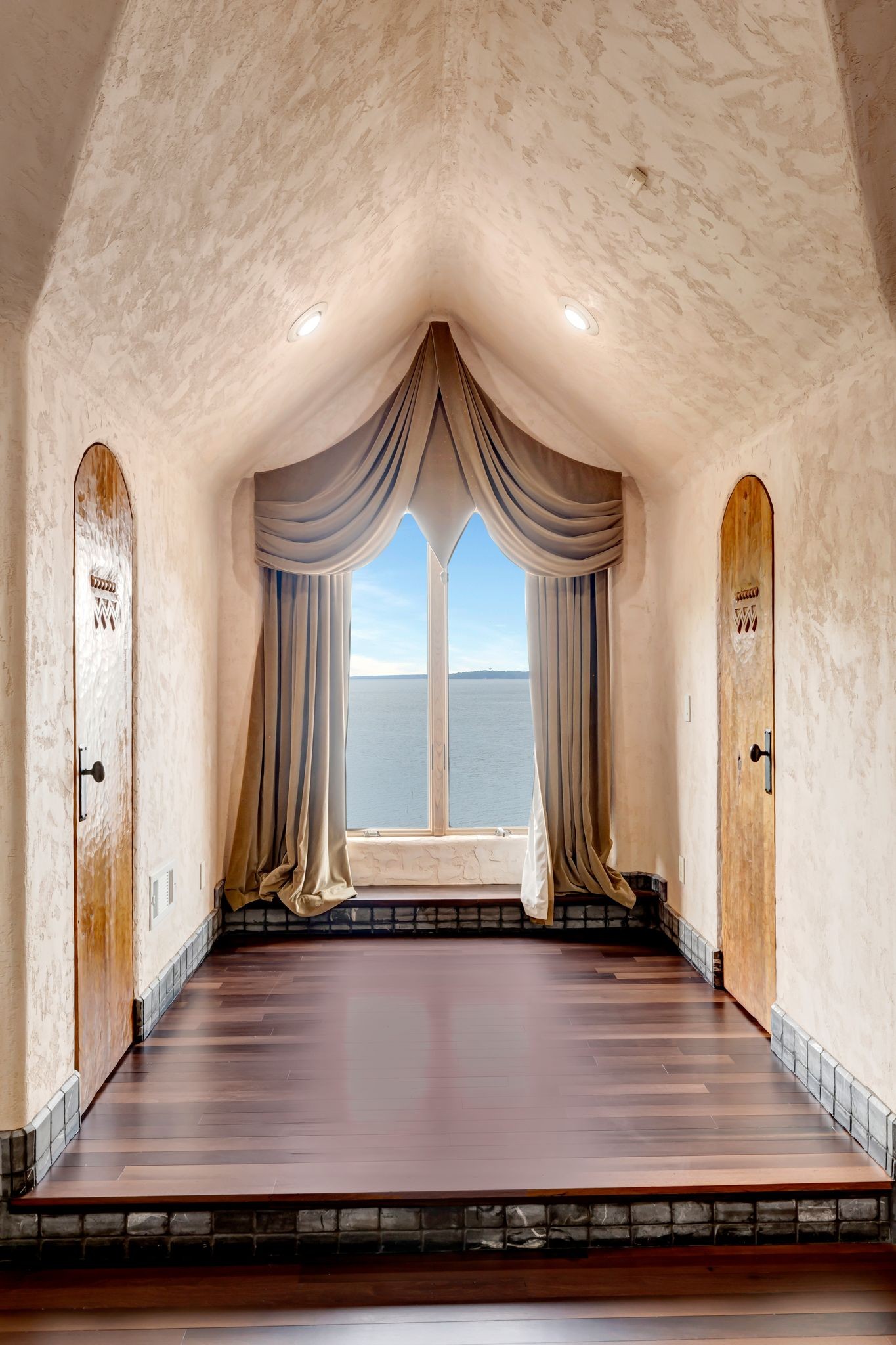 721 Three Point Road Muscle Shoals, AL 35661 - Photo 31 of 51 a view of a hallway with wooden floor and staircase