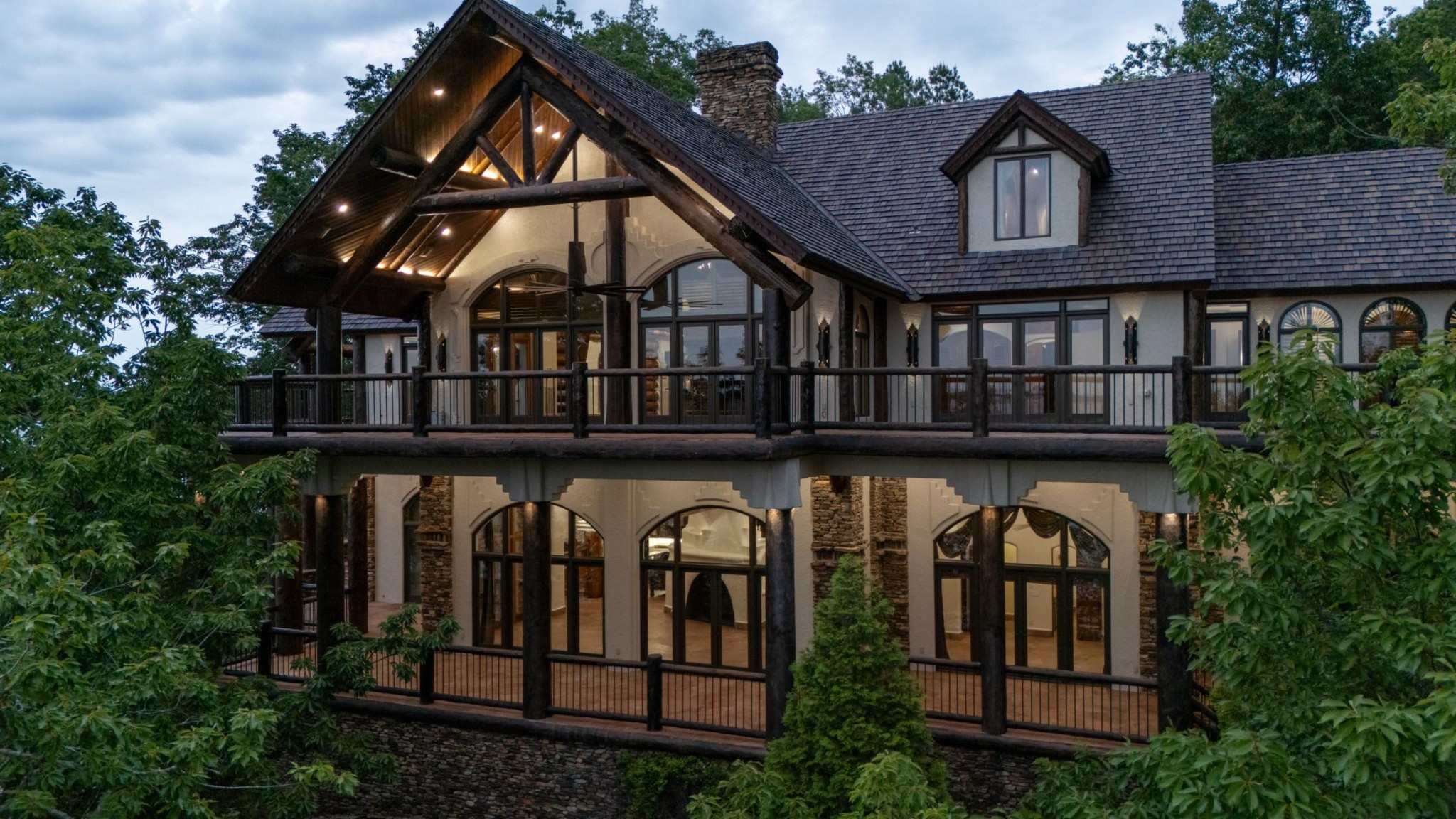 721 Three Point Road Muscle Shoals, AL 35661 - Photo 9 of 51 a view of a brick house with large windows and a small yard