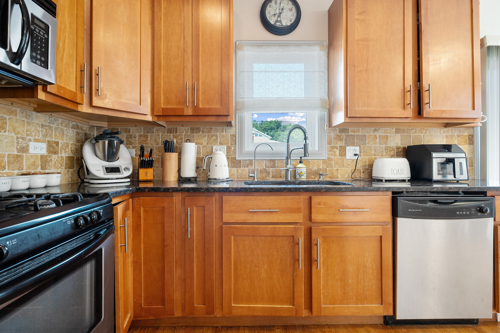 3638 North Odell Avenue Chicago, IL 60634 - Photo 13 of 46 a kitchen with stainless steel appliances granite countertop a stove and a refrigerator