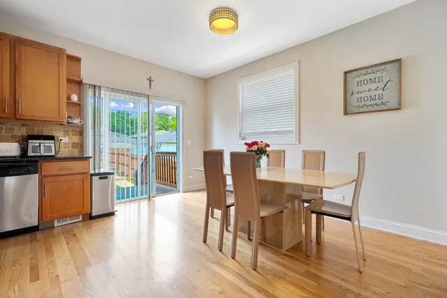a view of a dining room with furniture and a window