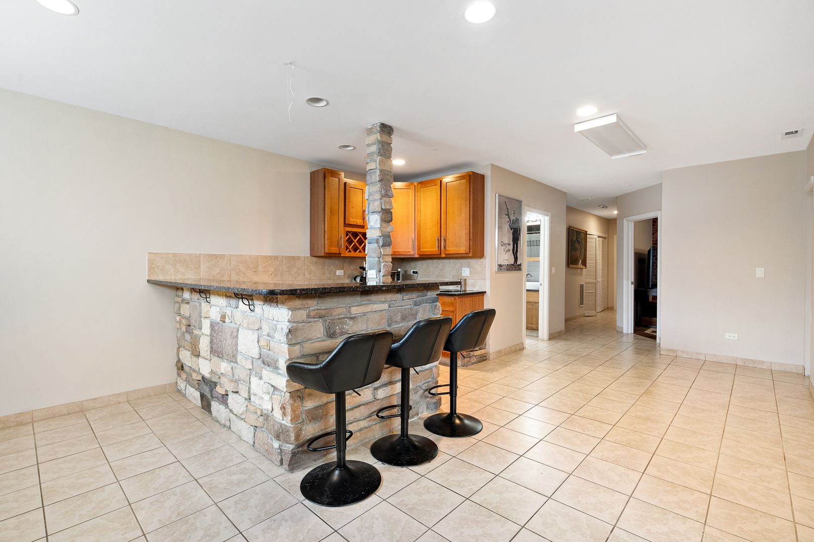 3638 North Odell Avenue Chicago, IL 60634 - Photo 17 of 46 a kitchen with stainless steel appliances kitchen island granite countertop a sink and a cabinets