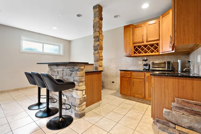 a kitchen with a sink cabinets and window