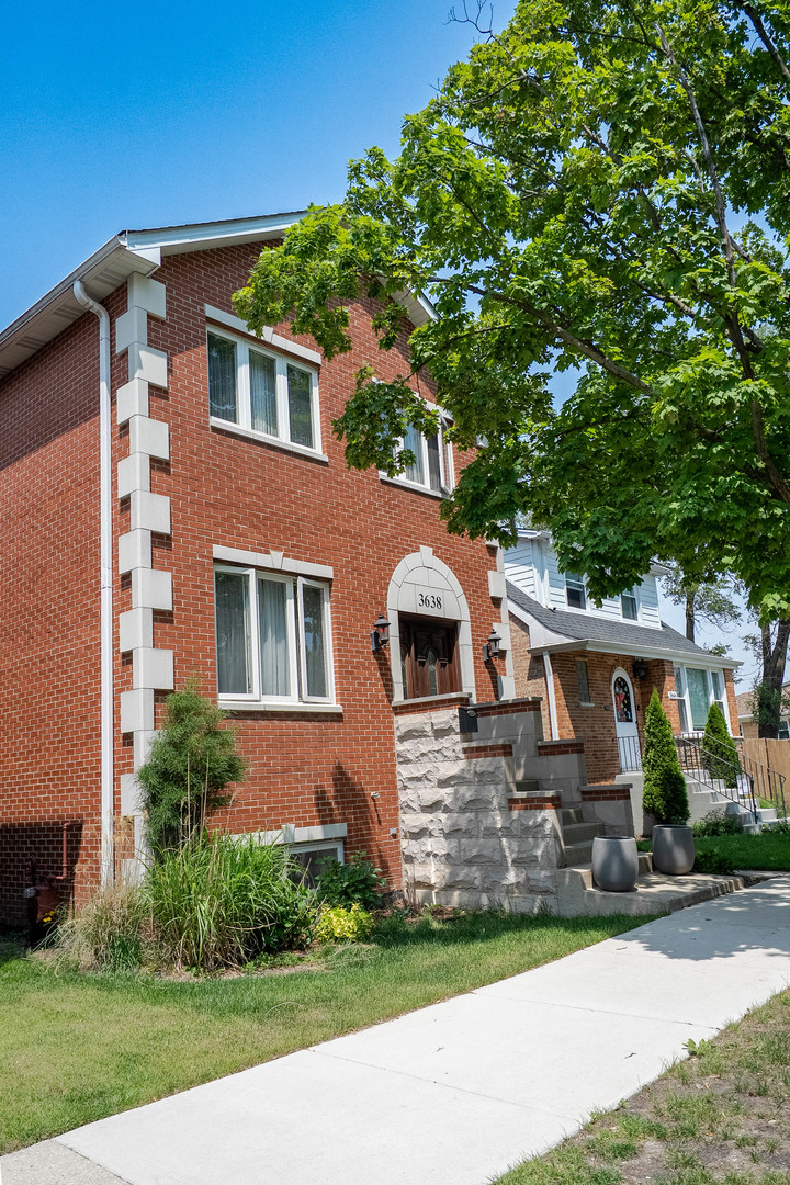 3638 North Odell Avenue Chicago, IL 60634 - Photo 2 of 46 a front view of a house with a yard