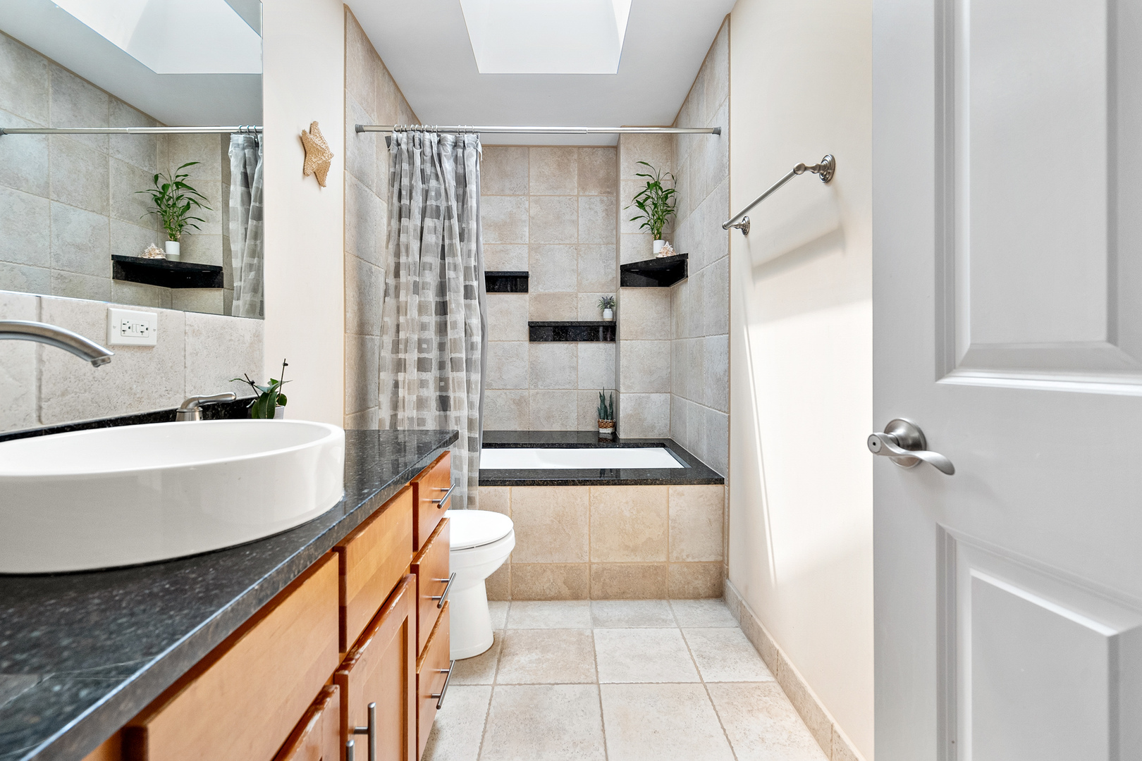 3638 North Odell Avenue Chicago, IL 60634 - Photo 26 of 46 a bathroom with a tub a sink and a shower