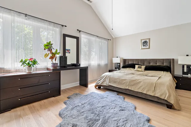 a bedroom with a bed and a dresser