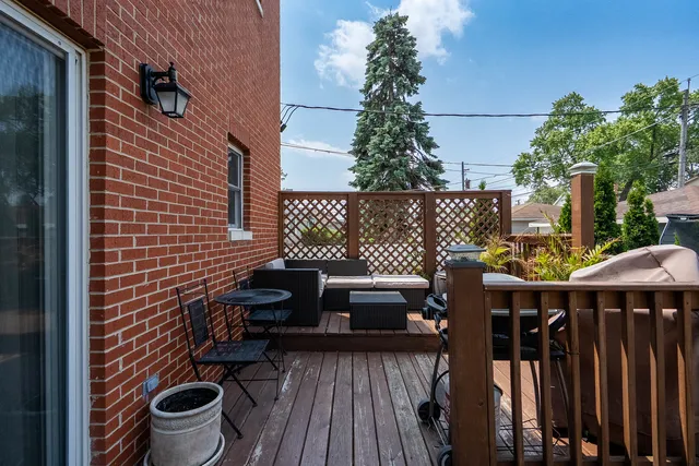 a balcony view with couple of chairs