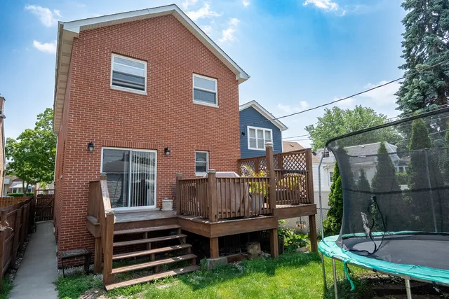 a view of a yard in front of a brick house
