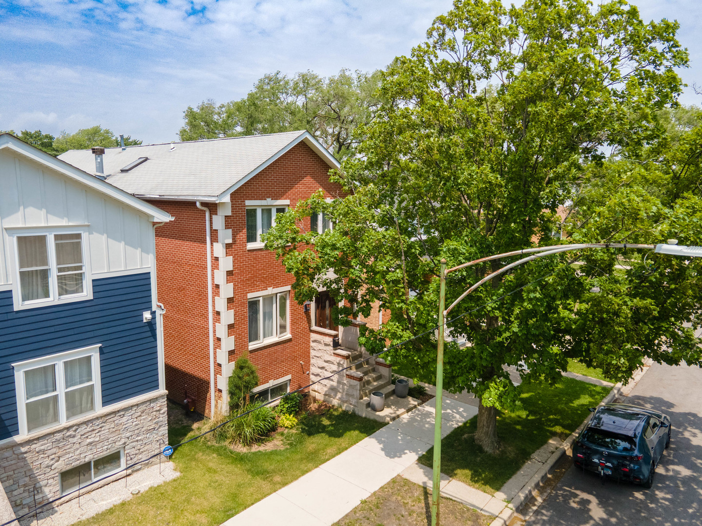 3638 North Odell Avenue Chicago, IL 60634 - Photo 40 of 46 a view of a yard in front of a brick house