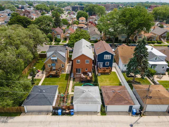 an aerial view of houses with yard