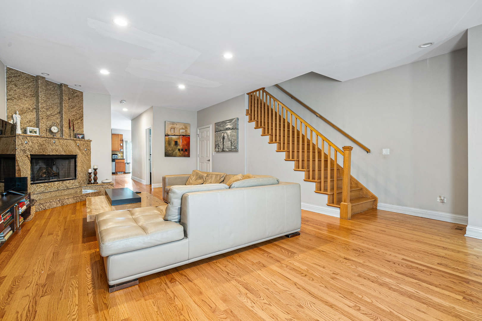 3638 North Odell Avenue Chicago, IL 60634 - Photo 6 of 46 a living room with fireplace furniture and a wooden floor