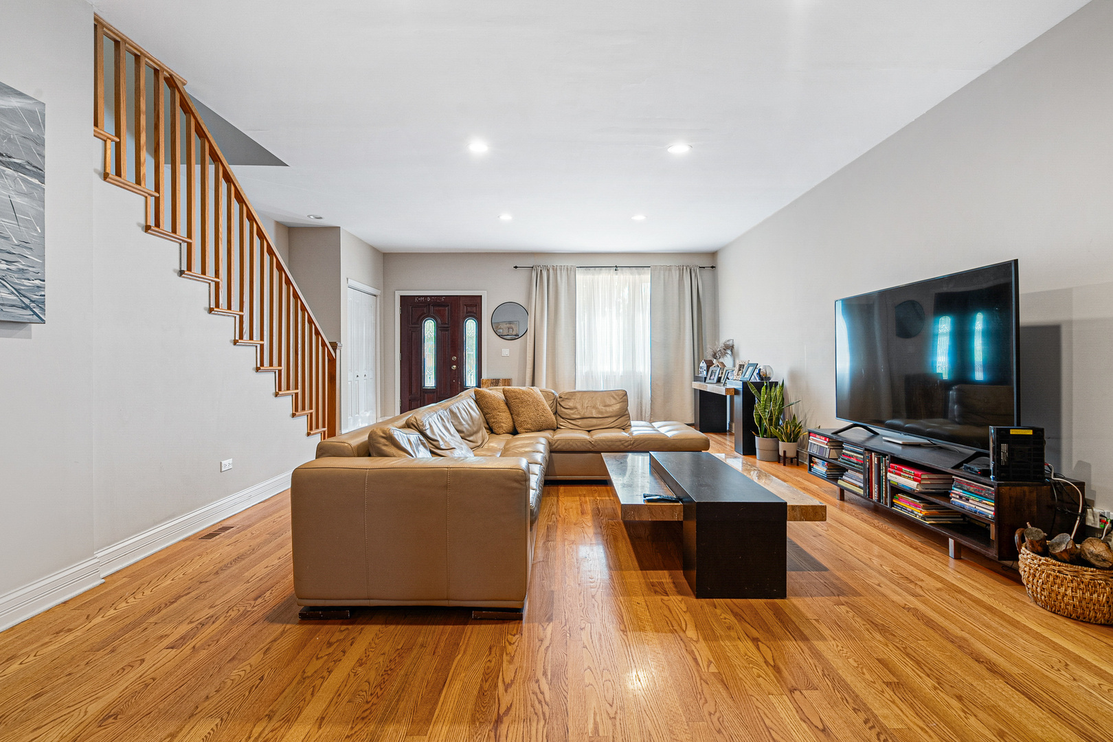3638 North Odell Avenue Chicago, IL 60634 - Photo 7 of 46 a living room with furniture and a flat screen tv
