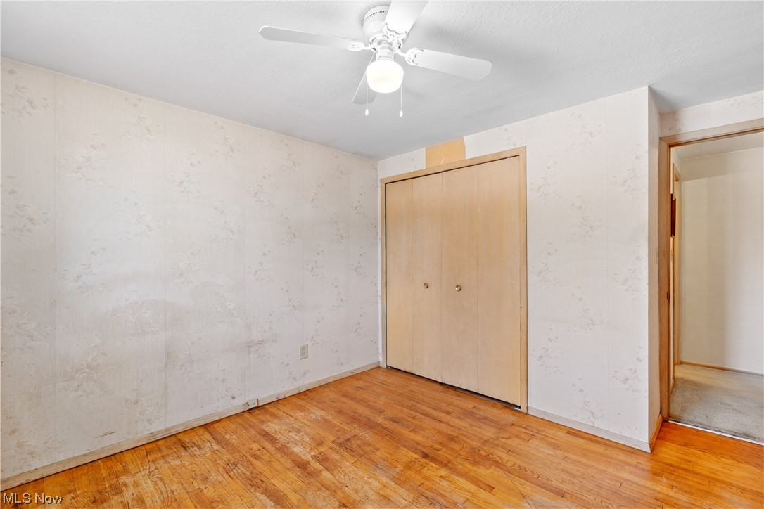 1722 Chelmsford Road Cleveland, OH 44124 - Photo 19 of 34 Bedroom featuring light carpet and ceiling fan