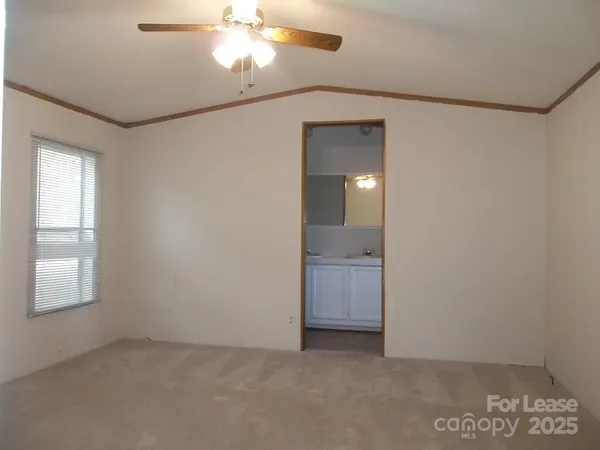 an empty room with a bathroom