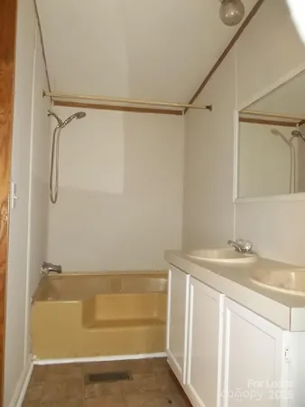 a bathroom with a sink and a shower