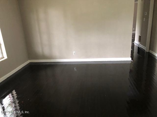 5612 Vernon Road Jacksonville, FL 32209 - Photo 3 of 7 a view of an empty room with wooden floor