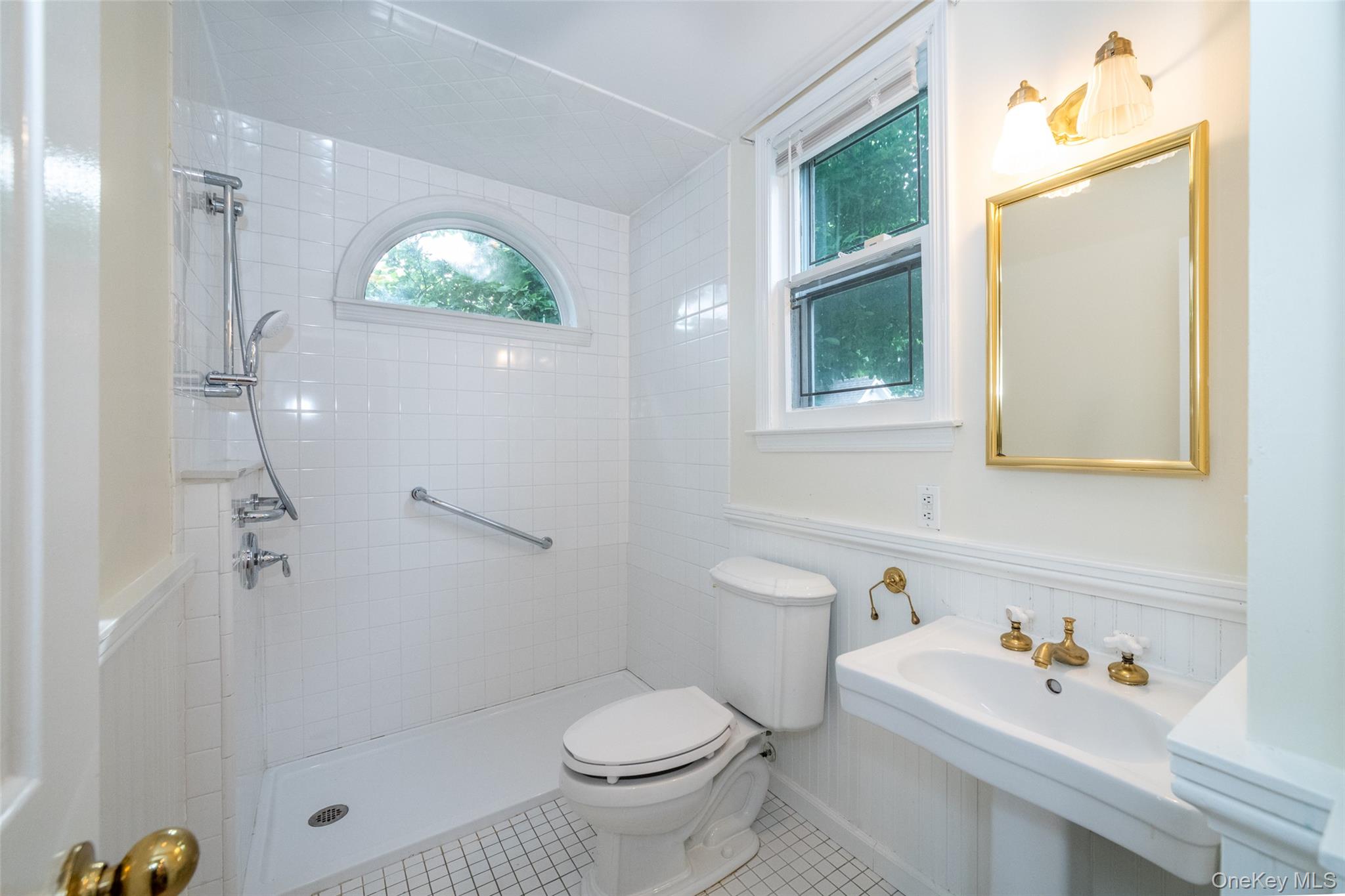 82 Clove Road New Rochelle, NY 10801 - Photo 10 of 39 a bathroom with a sink toilet and shower