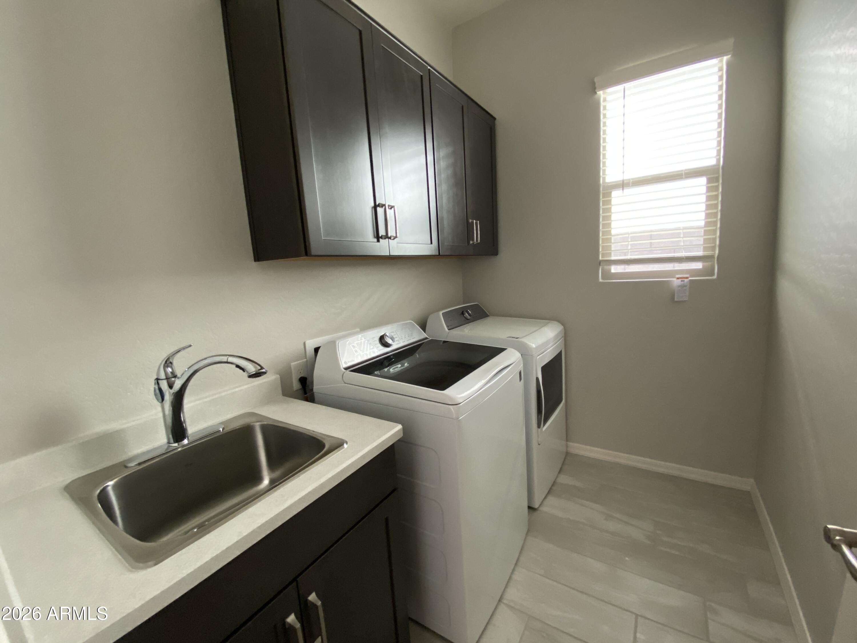 4150 East Bernice Street Gilbert, AZ 85295 - Photo 13 of 25 a utility room with sink dryer and washer