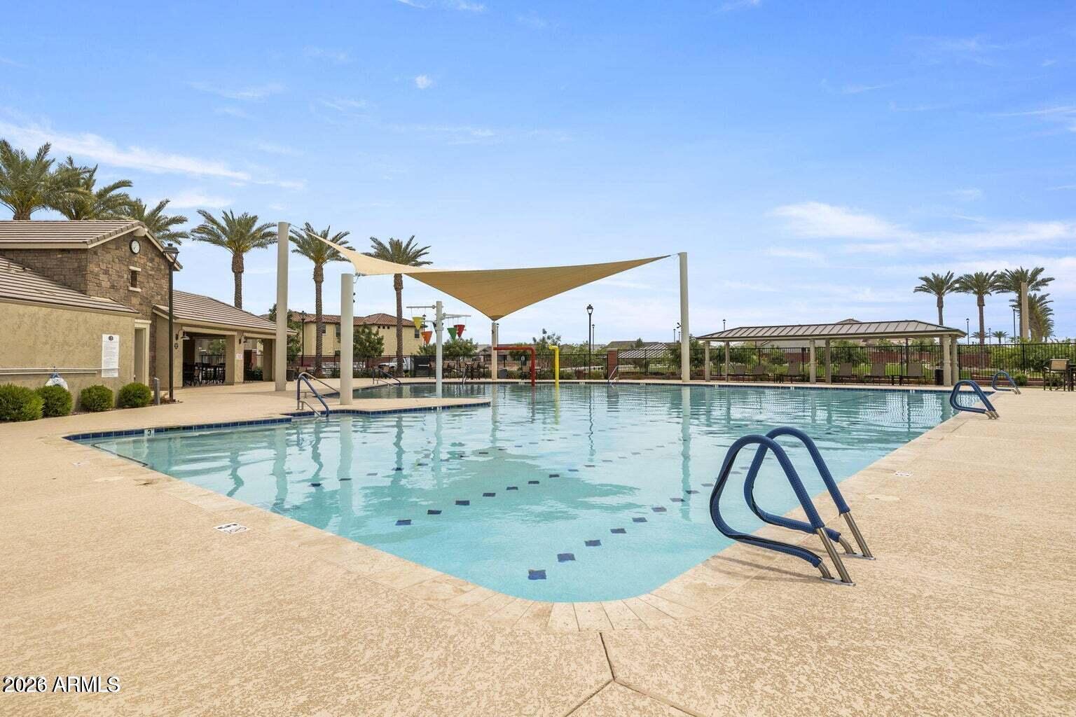 4150 East Bernice Street Gilbert, AZ 85295 - Photo 21 of 25 a view of a swimming pool with a lake view