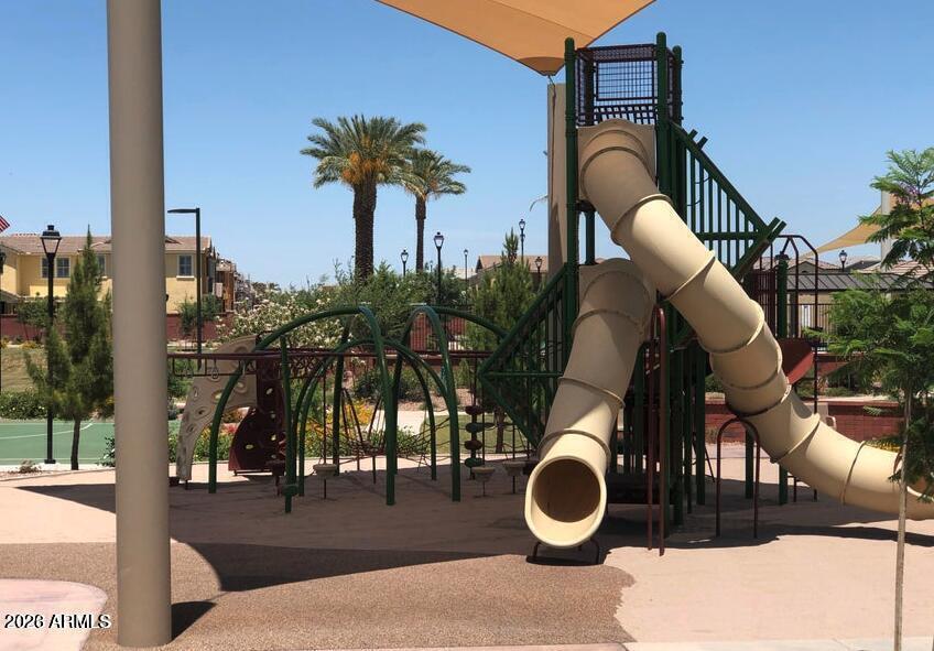 4150 East Bernice Street Gilbert, AZ 85295 - Photo 23 of 25 a backyard of a house with barbeque oven table and chairs