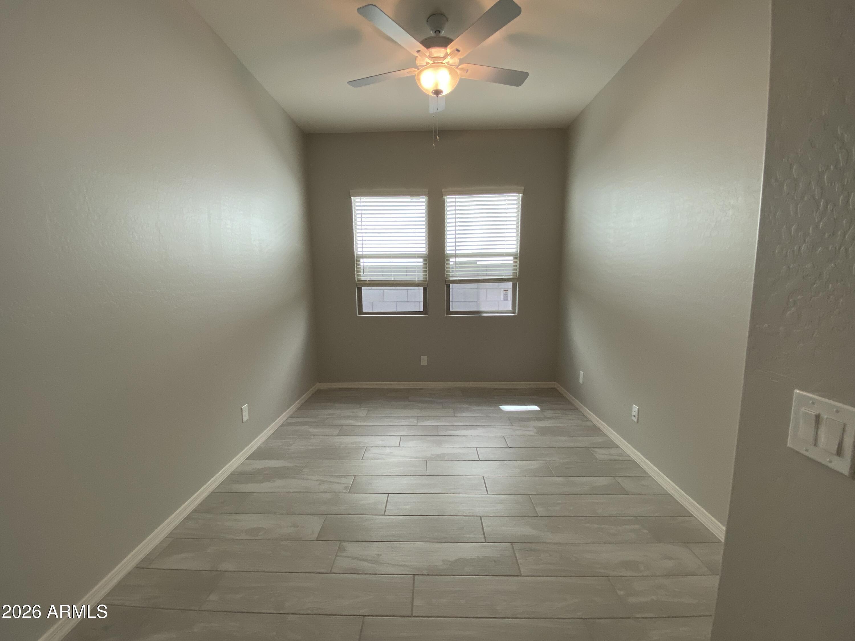 4150 East Bernice Street Gilbert, AZ 85295 - Photo 10 of 25 wooden floor in an empty room with a window