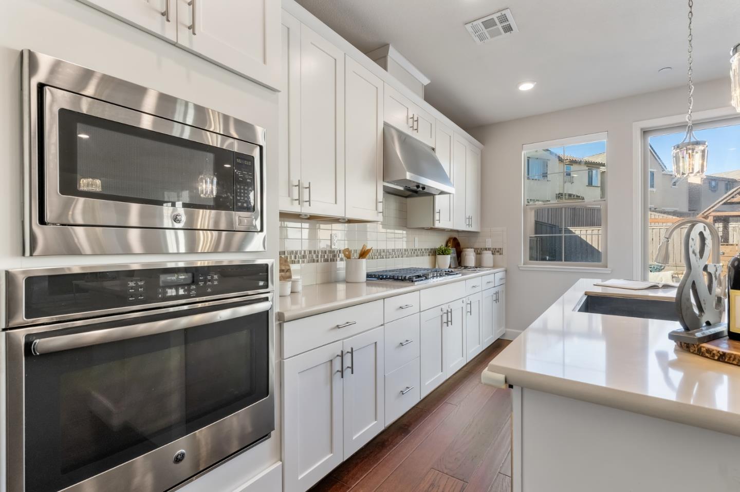 261 Crestview Circle Daly City, CA 94015 - Photo 11 of 45 a kitchen with stainless steel appliances kitchen island granite countertop a stove microwave and sink