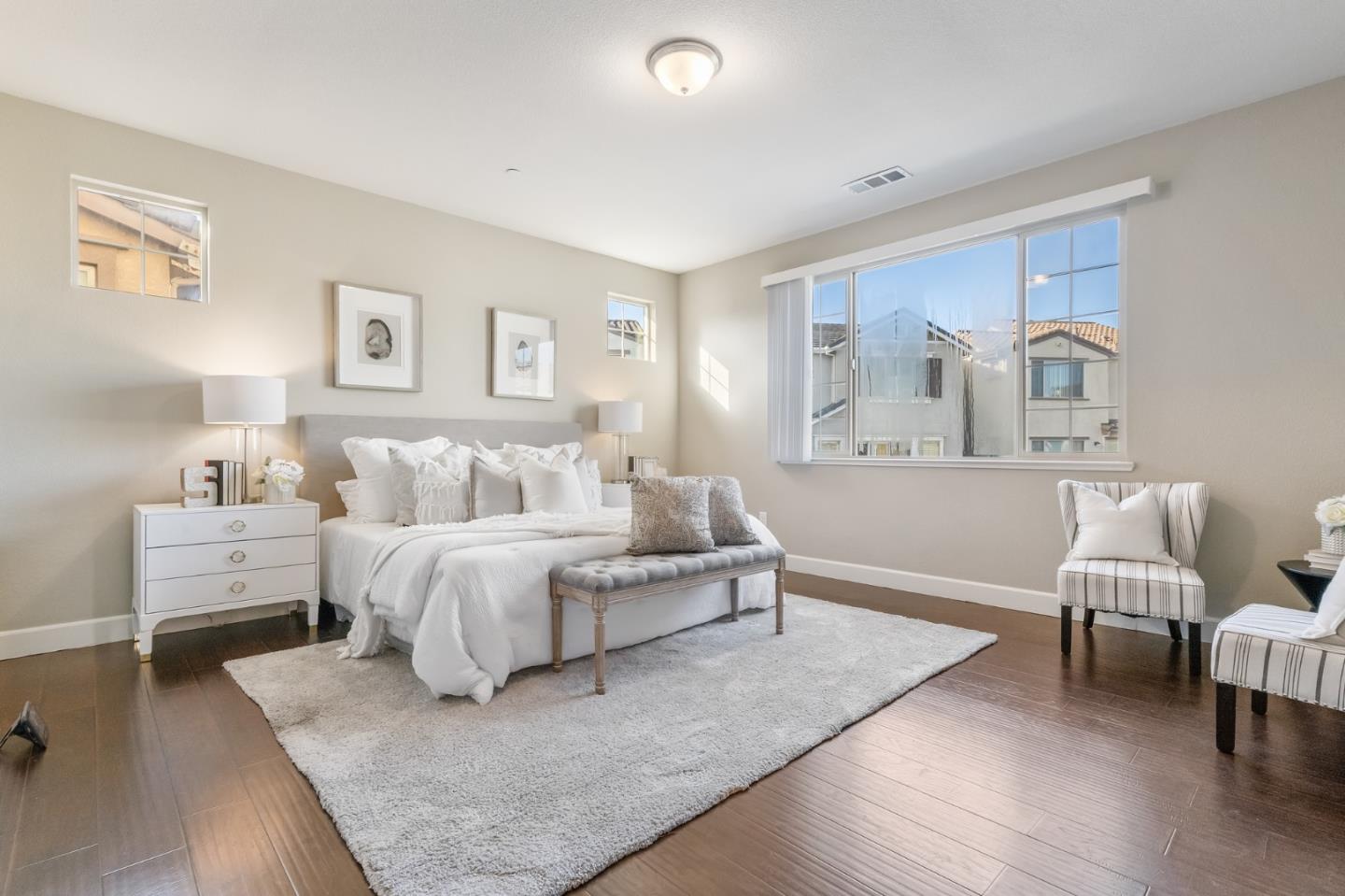 261 Crestview Circle Daly City, CA 94015 - Photo 22 of 45 a spacious bedroom with a bed and a couch
