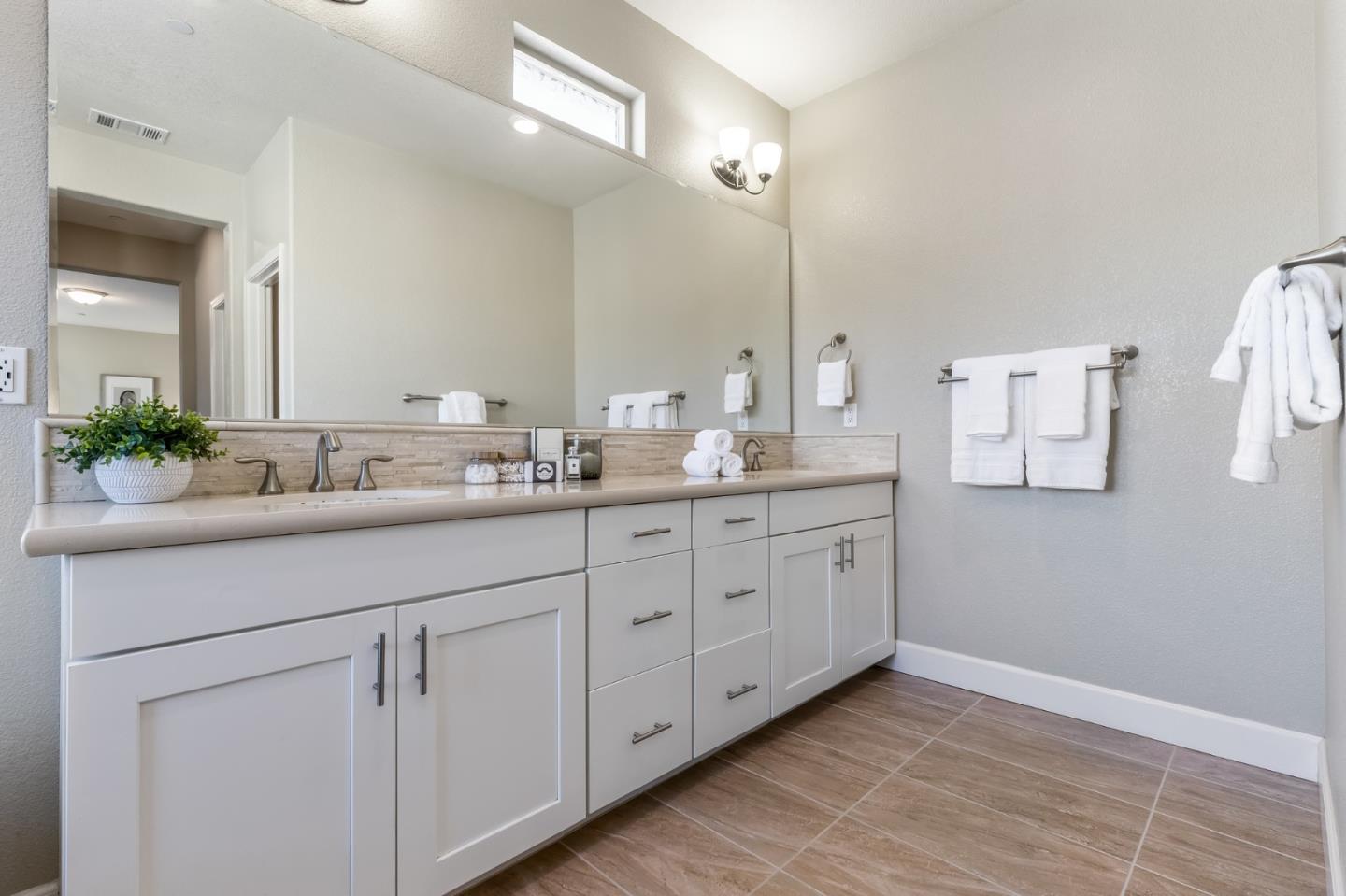 261 Crestview Circle Daly City, CA 94015 - Photo 27 of 45 a bathroom with a double vanity sink and a mirror