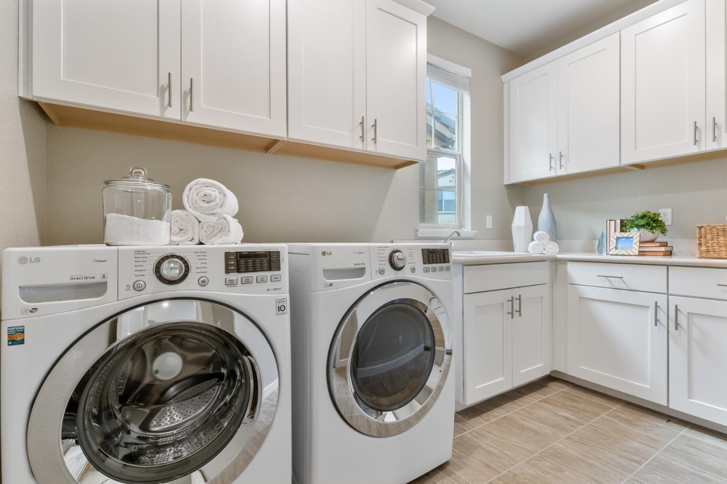 261 Crestview Circle Daly City, CA 94015 - Photo 31 of 45 a utility room with sink dryer and washer
