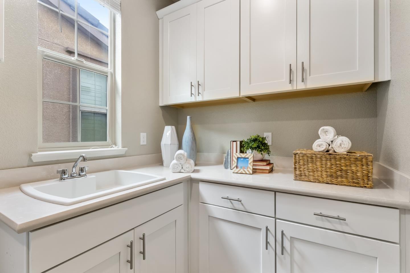 261 Crestview Circle Daly City, CA 94015 - Photo 32 of 45 a kitchen with white cabinets and a sink