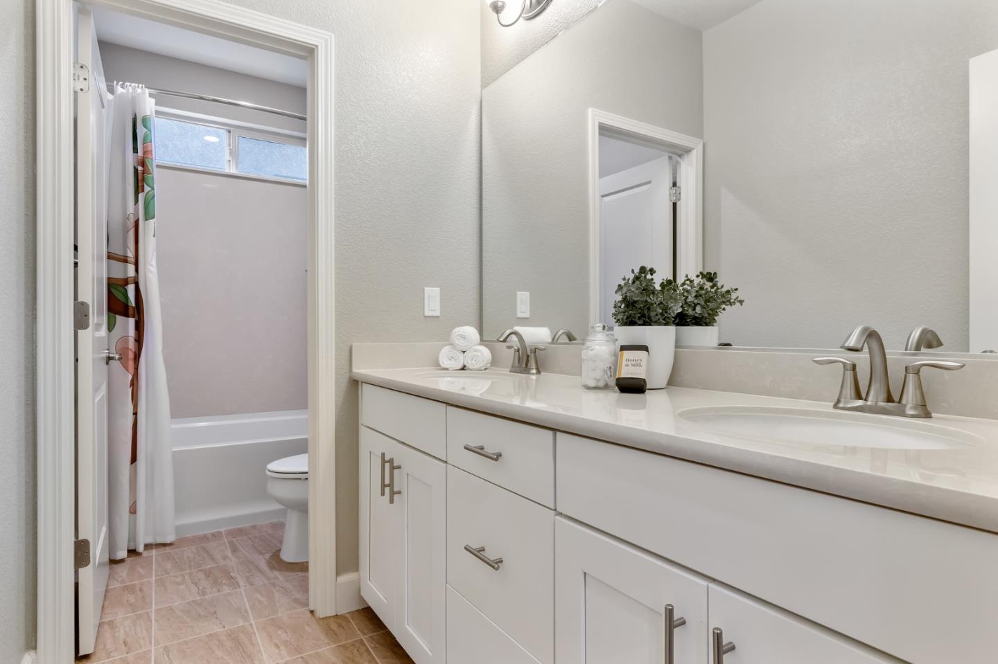 261 Crestview Circle Daly City, CA 94015 - Photo 34 of 45 a bathroom with a double vanity sink and a mirror