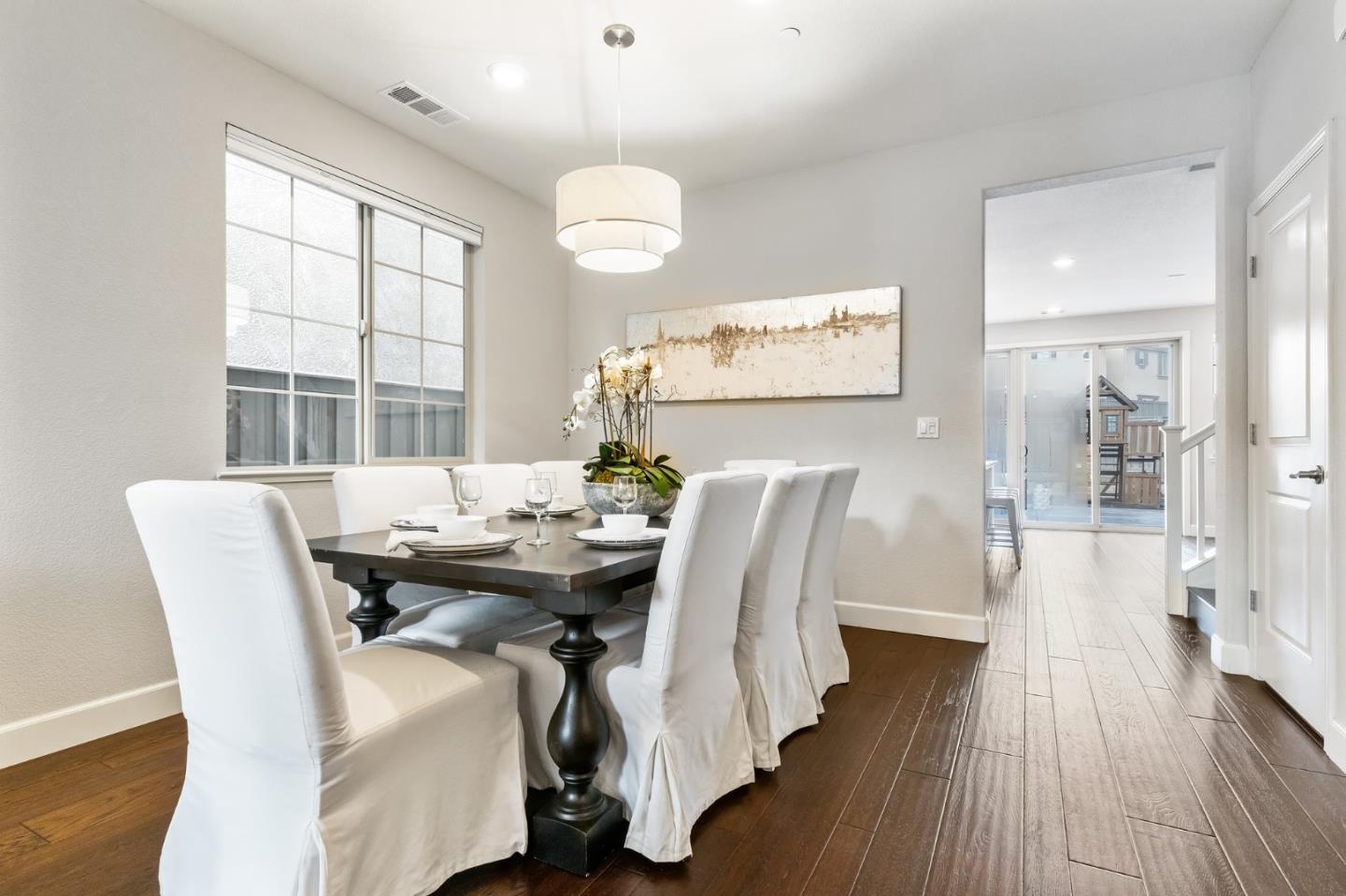 261 Crestview Circle Daly City, CA 94015 - Photo 6 of 45 a view of a dining room with furniture and wooden floor