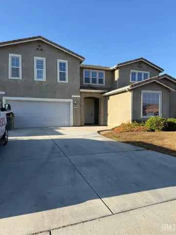 a front view of a house with yard