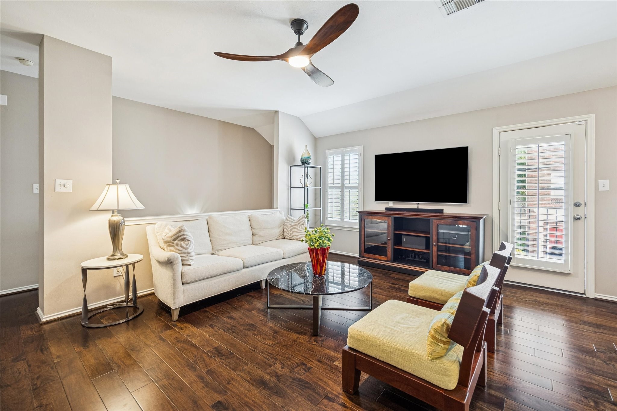 1810 Gillette Street Houston, TX 77019 - Photo 12 of 25 a living room with furniture a flat screen tv and wooden floor