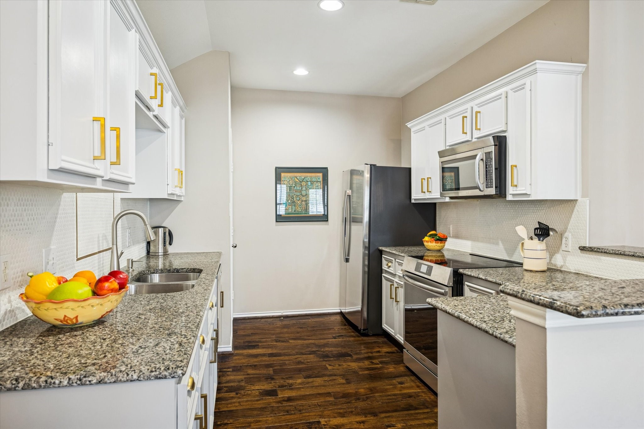 1810 Gillette Street Houston, TX 77019 - Photo 13 of 25 a kitchen with stainless steel appliances granite countertop a sink stove and refrigerator