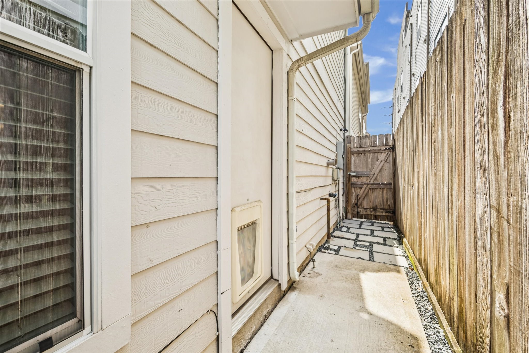 1810 Gillette Street Houston, TX 77019 - Photo 22 of 25 a view of a house with a door and a window