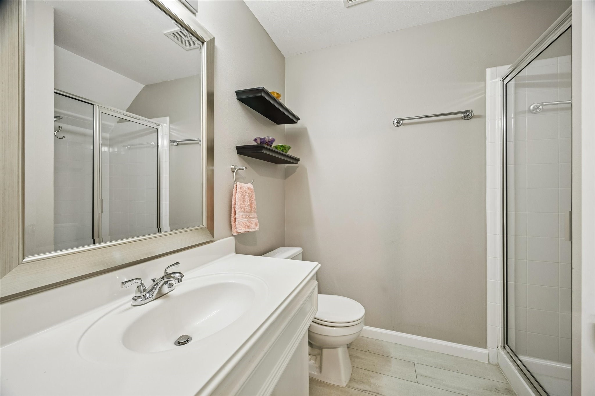1810 Gillette Street Houston, TX 77019 - Photo 6 of 25 a bathroom with a sink a toilet and shower