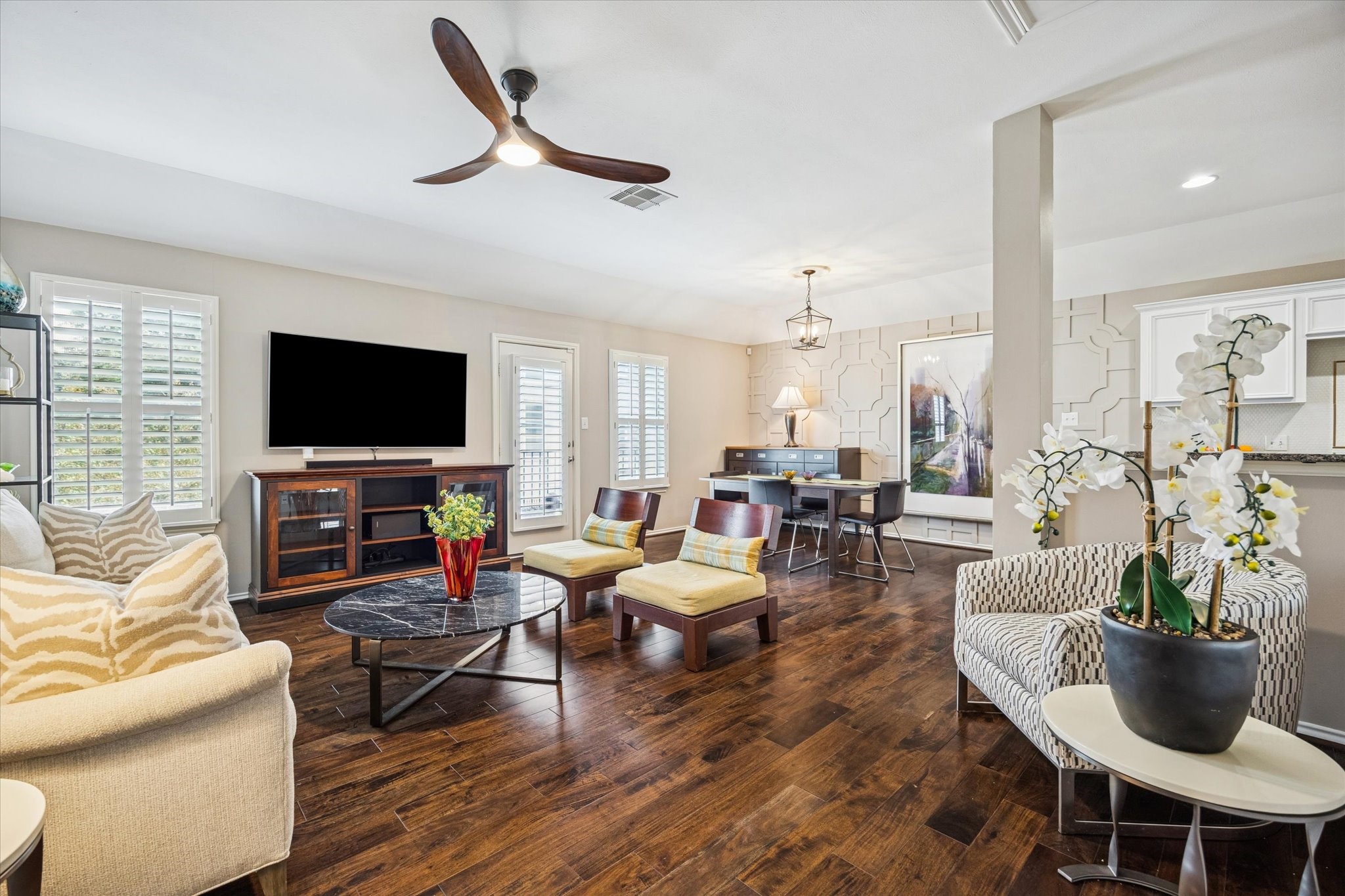 1810 Gillette Street Houston, TX 77019 - Photo 8 of 25 a living room with furniture a flat screen tv and kitchen view